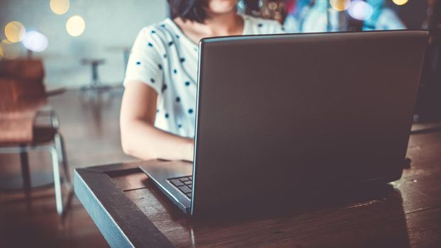  Woman use technology devices smartphone and laptop to work or study do connect communication business concept
