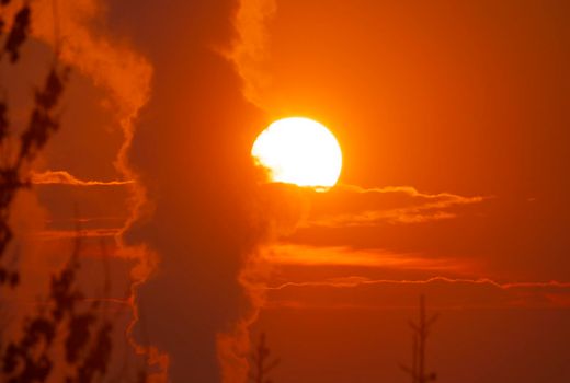 smoke factory sunrise big sun clouds zoom