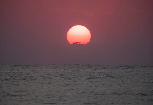 big sun down over sea sunrise, red sky