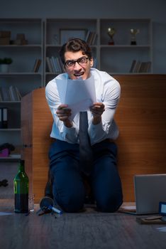 Stressed businessman working overtime in depression