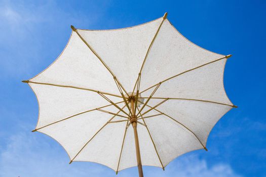 White umbrella with sky