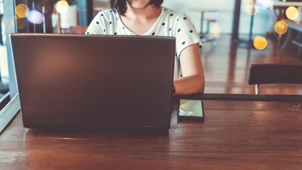  Woman use technology devices smartphone and laptop to work or study do connect communication business concept
