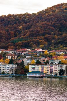 View of Danube river and Orsova city vegetation and buildings, waterfront view. Orsova, Romania, 2021