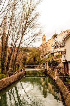Water channel in Alcala del Jucar and vegetation