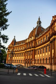 View of Justice Palace facade building which currently houses the Brasov Prefecture, the County Council and the Court of Appeal. Brasov, Romania. Exterior architectural details