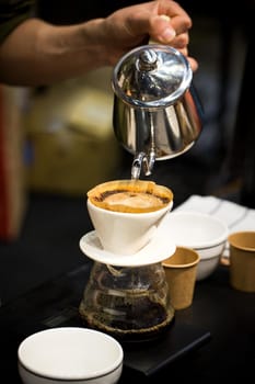 Professional barista preparing coffee alternative method