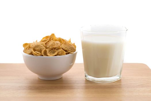 milk and cereal on white background