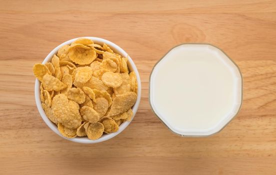 milk and cereal on wood background