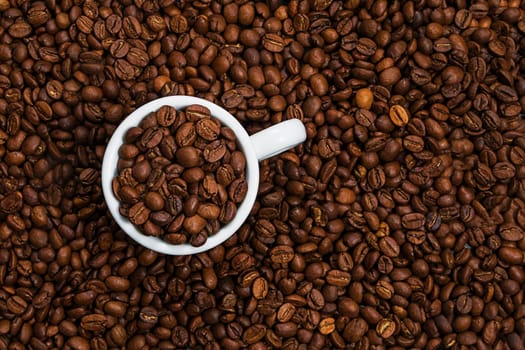 Cup with coffee beans, close up