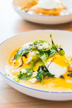 Mushroom and egg benedict in white plate for breakfast