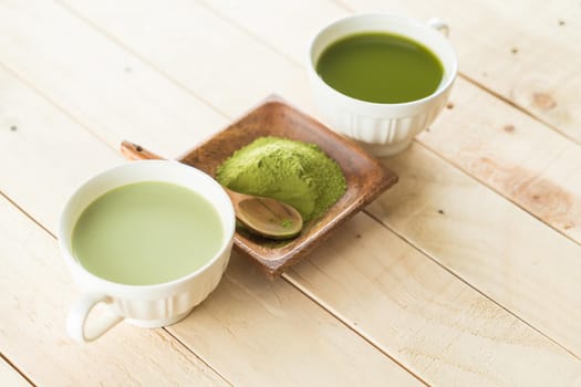 hot matcha latte on wood