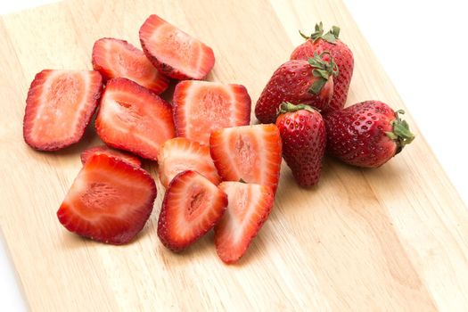 strawberry slice on wood board