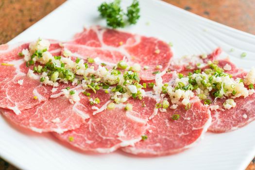 Slide raw meat on the table