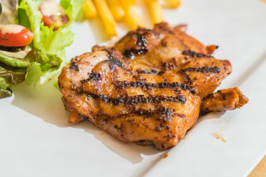 grill chicken steak on white plate