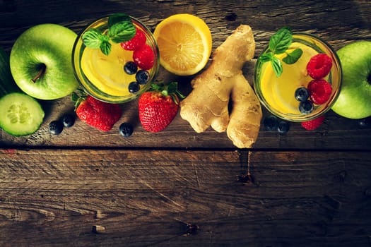 Tasty beautiful ingredients fruits for making healthy detox drinks or smoothies. Wooden rustic background. Top View. Copy Space.