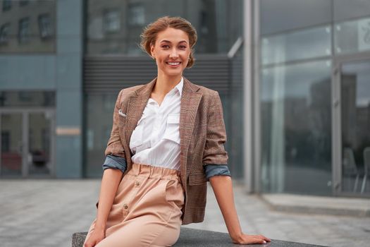 Businesswoman successful woman business person standing outdoor corporate building exterior Smile happy caucasian confidence professional business woman middle age female entrepreneur Bank employee