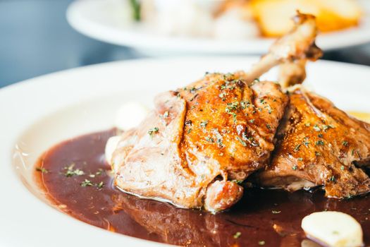 Duck breast steak with sauce in white plate