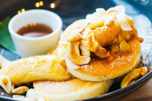 Sweet dessert pancake and banana with cashew , honey sauce