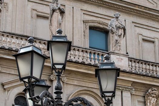 detail of the cathedral of terni street lamps placed in front