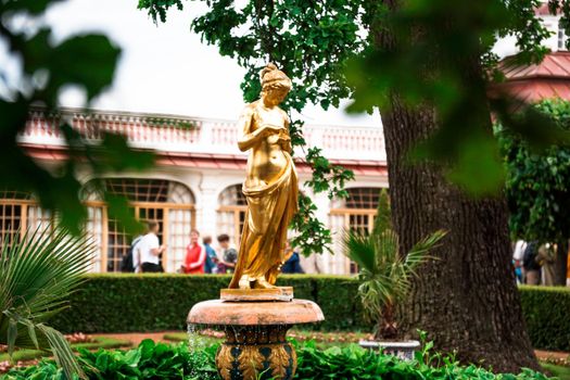 Saint-Petersburg, Russia - Monplaisir garden with a golden statue in Peterhof