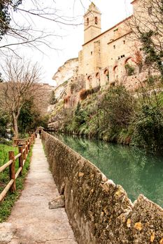 Water channel in Alcala del Jucar and vegetation