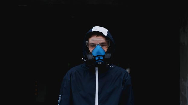 Protection respirator half mask for toxic gas.The man prepare to wear protection air pollution in the chemical industry