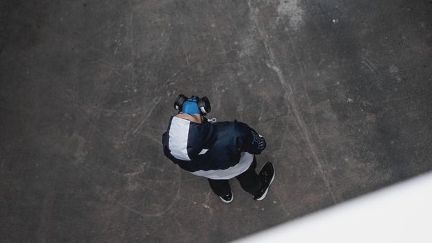 Protection respirator half mask for toxic gas.The man prepare to wear protection air pollution in the chemical industry. View from above