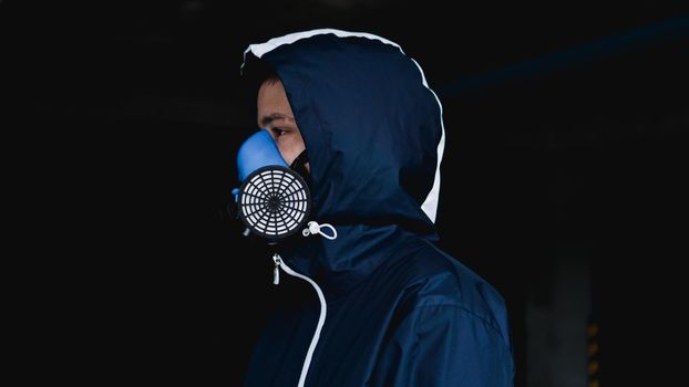 Protection respirator half mask for toxic gas.The man prepare to wear protection air pollution in the chemical industry