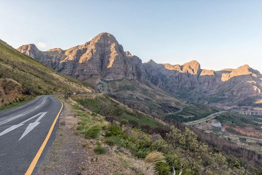 View of the Du Toitskloof Pass and road N1 at the western exit of the Huguenot Tunnel near Paarl in the Western Cape Province. The mountains and vehicles are visible