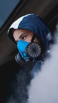 Protection respirator half mask for toxic gas.The man prepare to wear protection air pollution in the chemical industry. Smoke