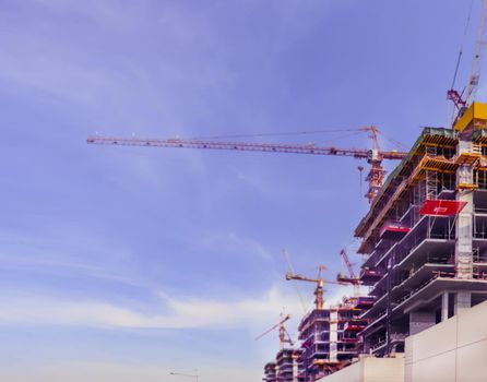 Construction site on blue background. Skyline, cityscape. Urban cityscape. Building machineryon sky blue background. United arab emirates.