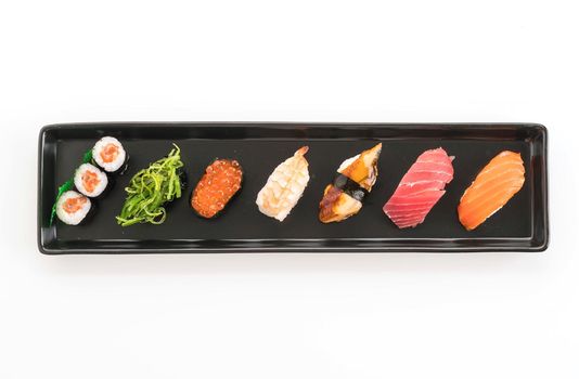 mixed sushi set - japanese food on white background
