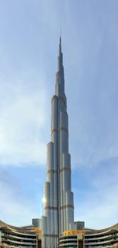 Arabic burj khalifa. Architecture building. Night dubai skyline. Dubai city background. Uae urban cityscape. Aerial view. Blue background. Panoramic view. Sky blue. United arab emirates.