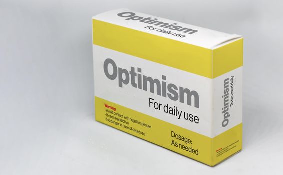 The box of an optimism medicine for daily use. Positive thinking and mindset. New beginnings and opportunities