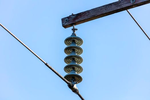 Photograph of a transmission line cable system connected to an assembly bracket