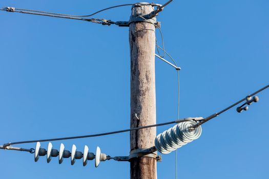 Photograph of a transmission line cable system connected to an assembly bracket