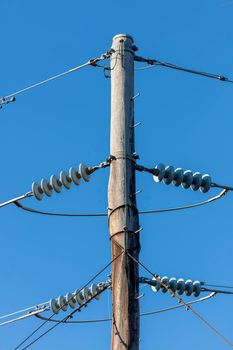 Photograph of a transmission line cable system connected to an assembly bracket