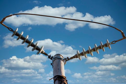 Photograph of a transmission line cable system connected to an assembly bracket