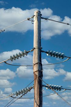 Photograph of a transmission line cable system connected to an assembly bracket