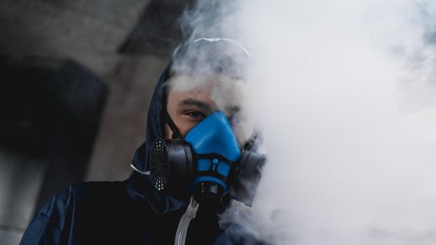 Protection respirator half mask for toxic gas.The man prepare to wear protection air pollution in the chemical industry. Smoke