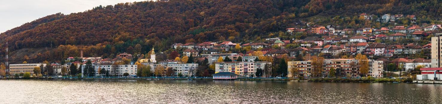 View of Danube river and Orsova city vegetation and buildings, waterfront view. Orsova, Romania, 2021