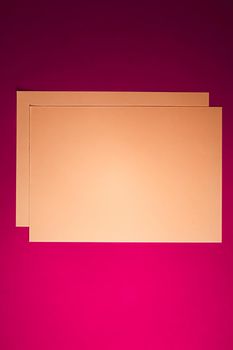 Blank A4 paper, brown on pink background as office stationery flatlay, luxury branding flat lay and brand identity design for mockup.