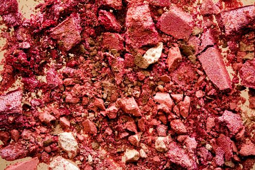 Crushed cosmetics, mineral organic eyeshadow, blush and cosmetic powder isolated on golden background, makeup and beauty banner, flatlay design.