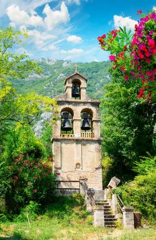 Bell tower in the back yard of church in Prcanj, Montenegro