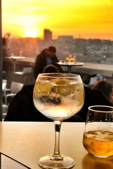 Glasses of gin tonic on table in Spain at sunset in a roof terrace