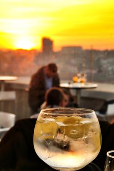 Glasses of gin tonic on table in Spain at sunset in a roof terrace