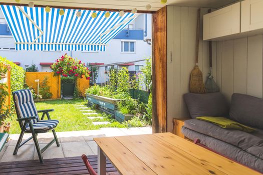 Cozy veranda with little green garden, summer time