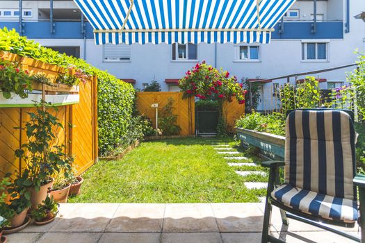 Cozy veranda with little green garden, summer time