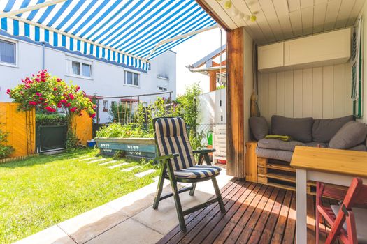 Cozy veranda with little green garden, summer time