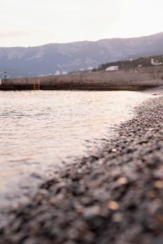 pebble stones beach in Crimea and the sea, nature background